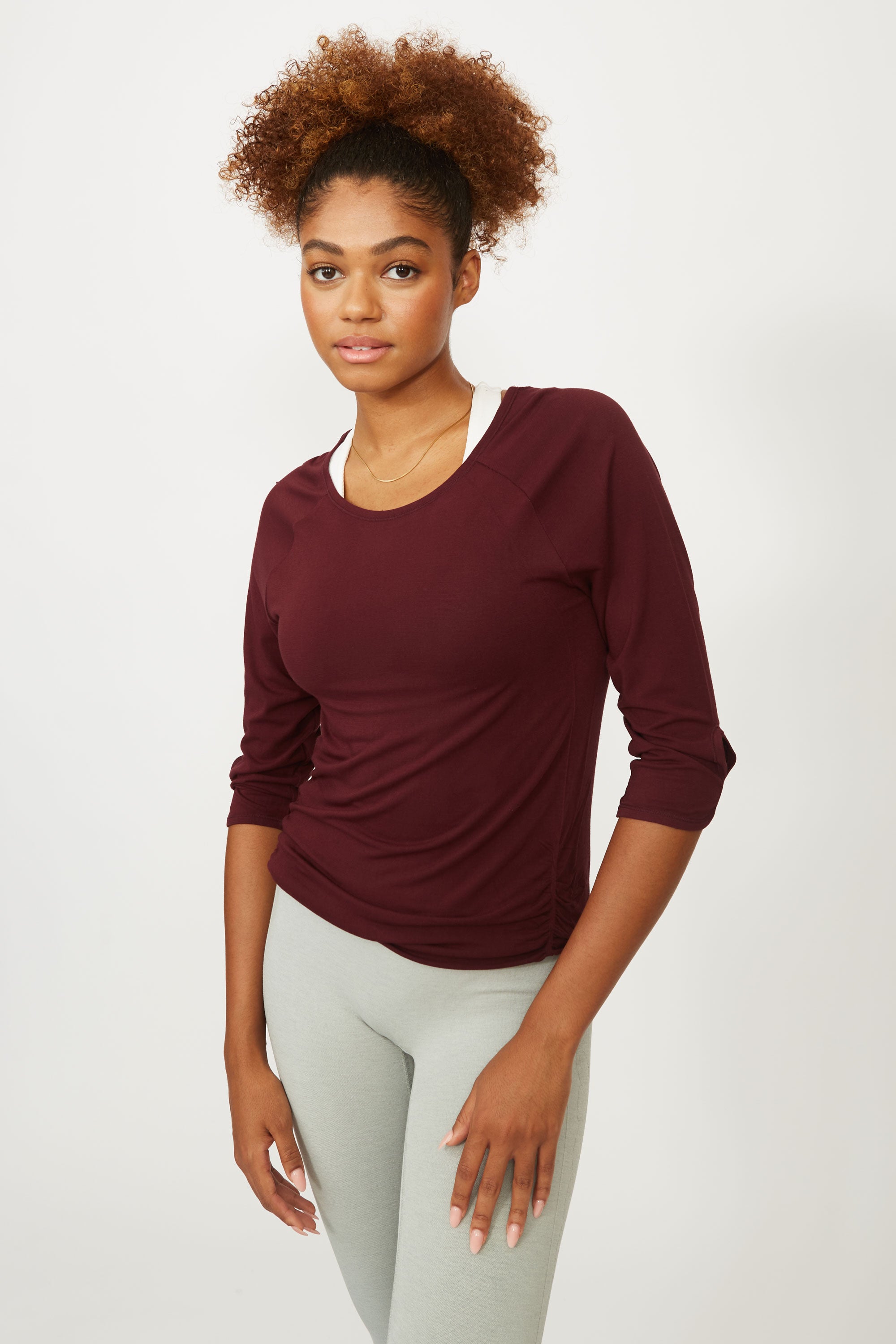 Dark cherry red soft bamboo 3/4 sleeve performance round neck top with side ruching for yoga, pilates, running and exercise by sustainable activewear brand Jilla Active.  Edit alt text