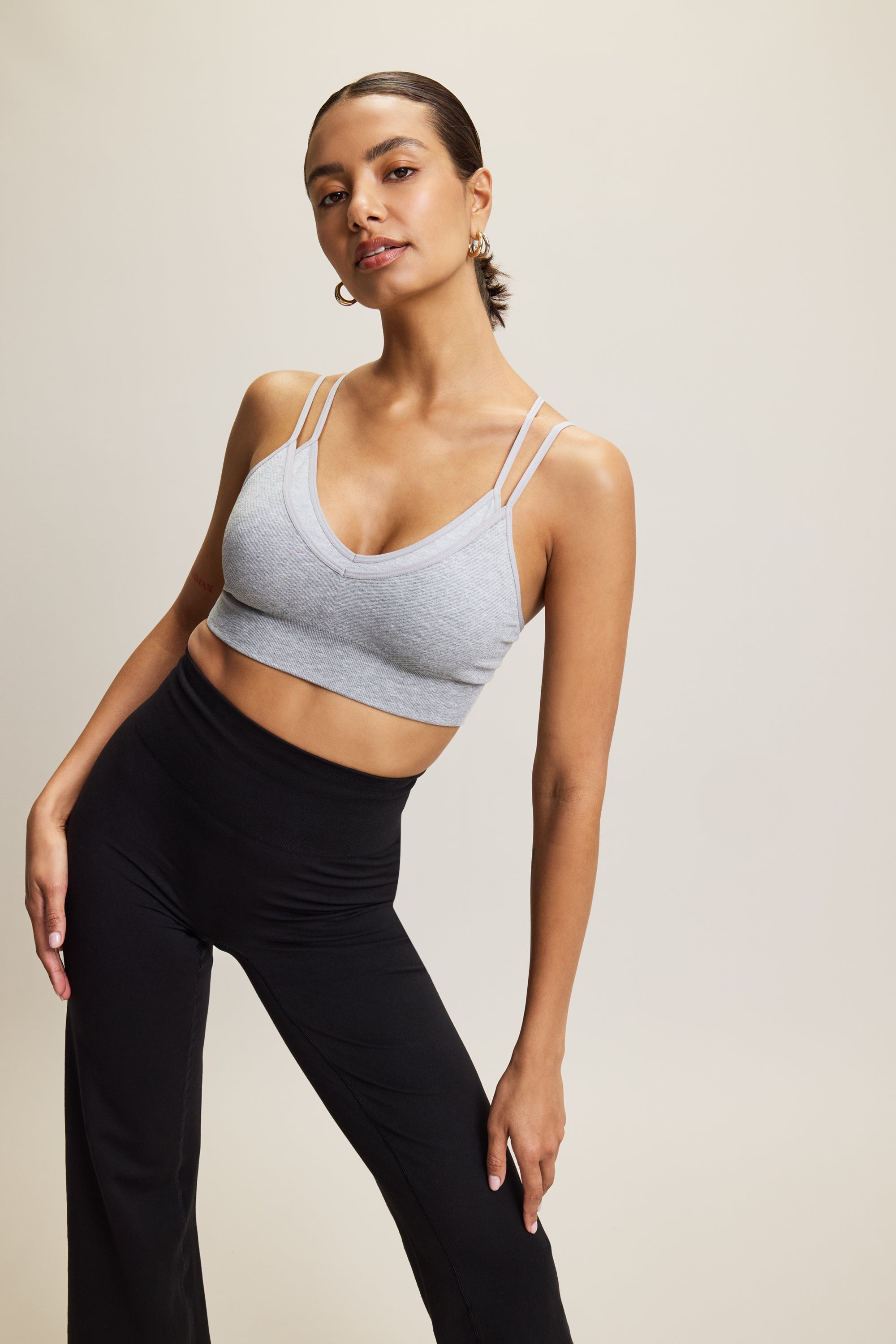 Introducing our Jilla Active grey Mandala Modal Yoga Bra crafted for style and comfort in low impact workouts. With a feminine double layered design, crossover straps, and textured detail, it offers both fashion and function. Seamlessly knitted in soft Lenzing Modal fabric, recycled polyamide, and elastane, it provides flexible support for yoga, pilates, and barre. With light support, triple-layered fabric, and removable pads, it ensures comfort and customization.