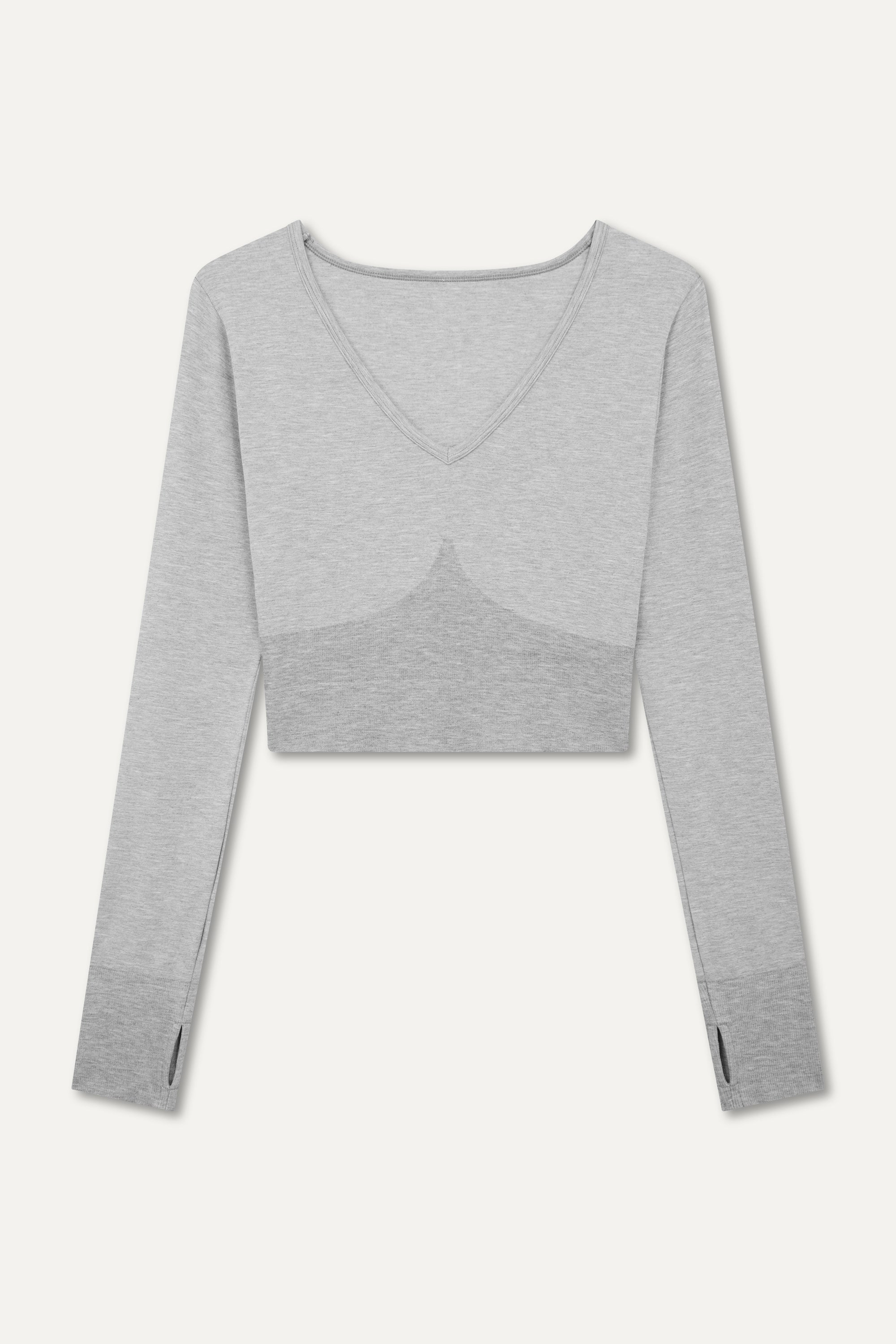 Jilla Active grey stylish cropped long-sleeve athleisure top made from eco-friendly bamboo fabric, featuring a flattering V-neckline, thumbholes for added comfort, and contouring panels for a sculpted fit. Perfect for activewear, this moisture-wicking and breathable top is ideal for workouts, yoga, and casual everyday outfits.